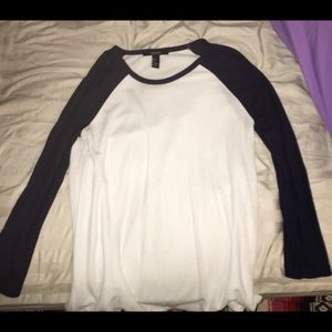 White half sleeve tee. Sleeves are dark blue.